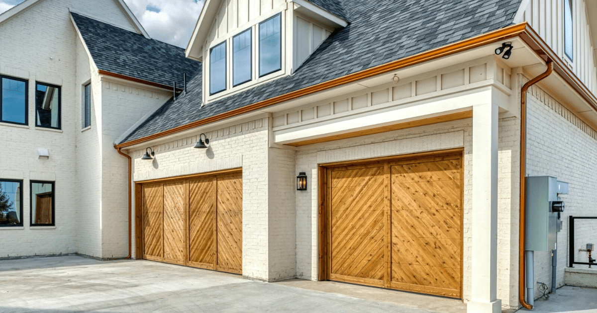 Modern garage with wooden doors and lights.