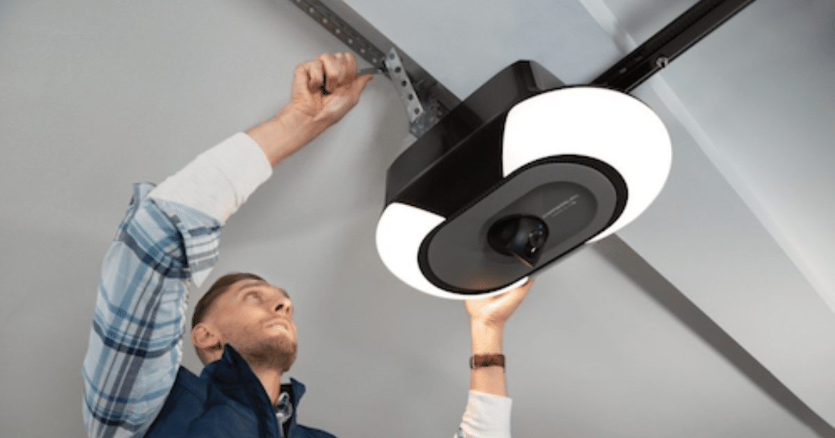 Man installs sleek garage door opener.