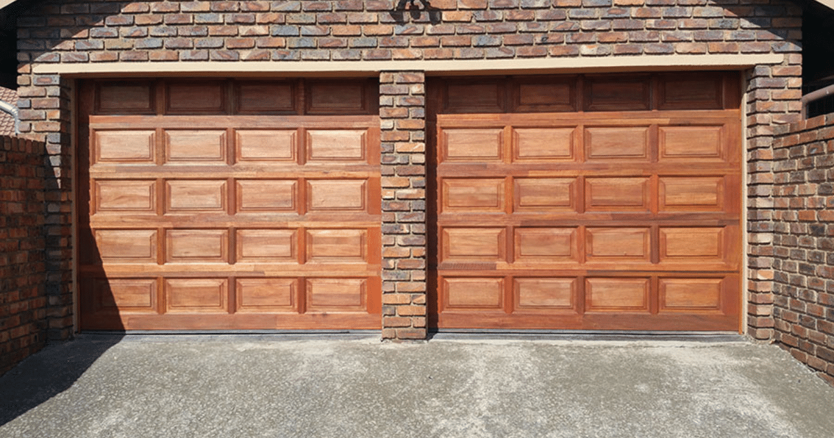 Double wood garage with raised panels.