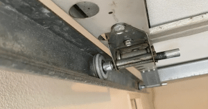 how to get a garage door wheel back on track