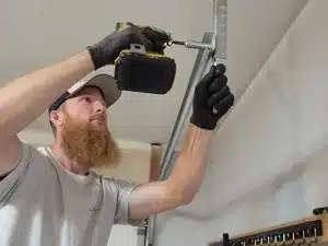 expert repairing garage door